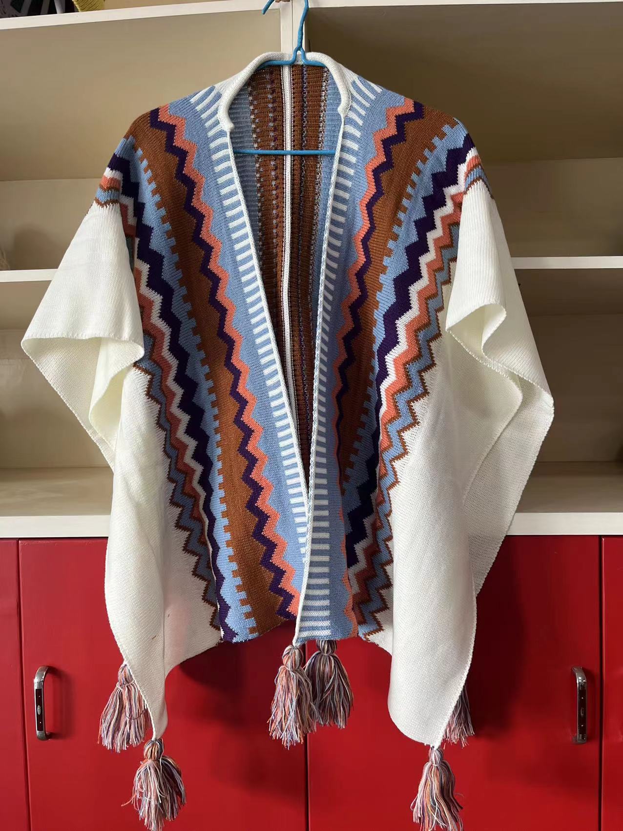 Bohemian Tassel Knit Cape – Free-Spirited & Stylish