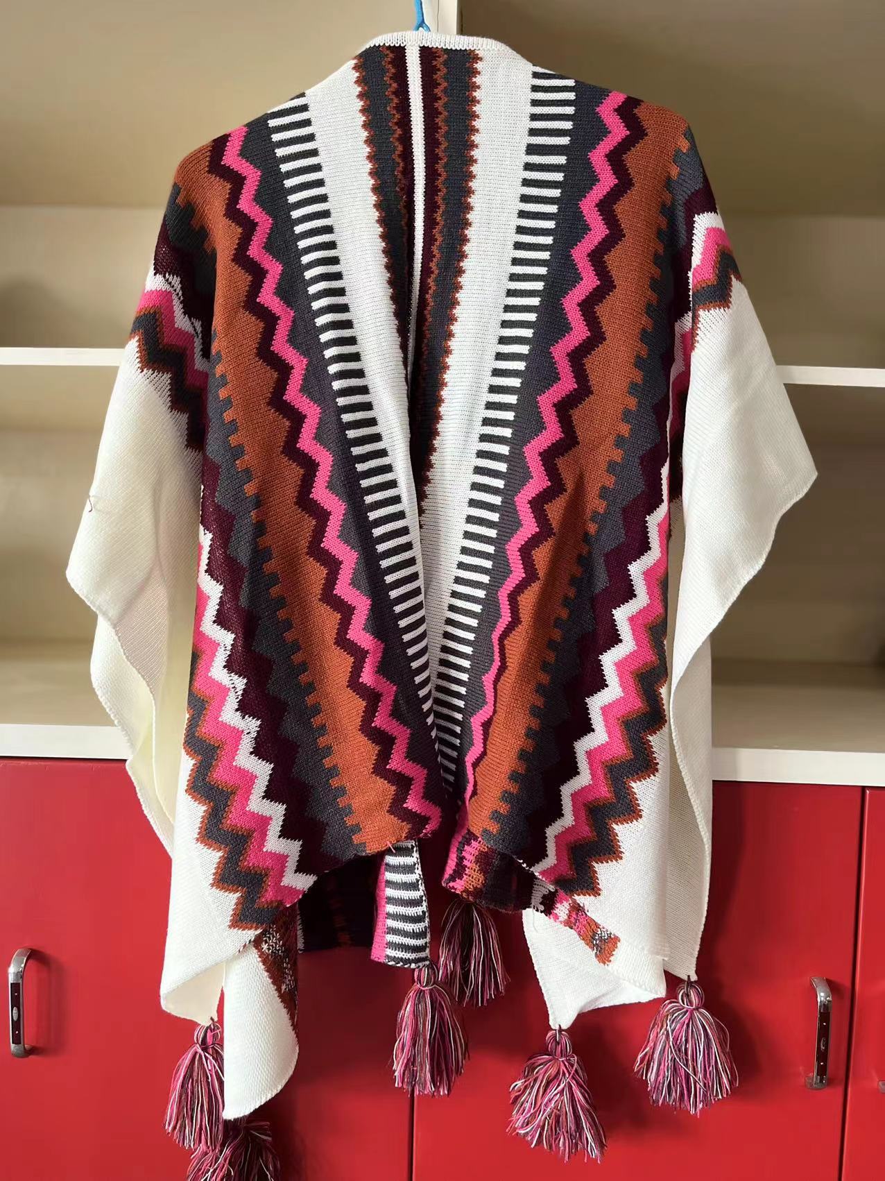 Bohemian Tassel Knit Cape – Free-Spirited & Stylish